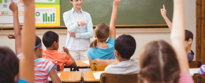 new teacher smiling in classroom