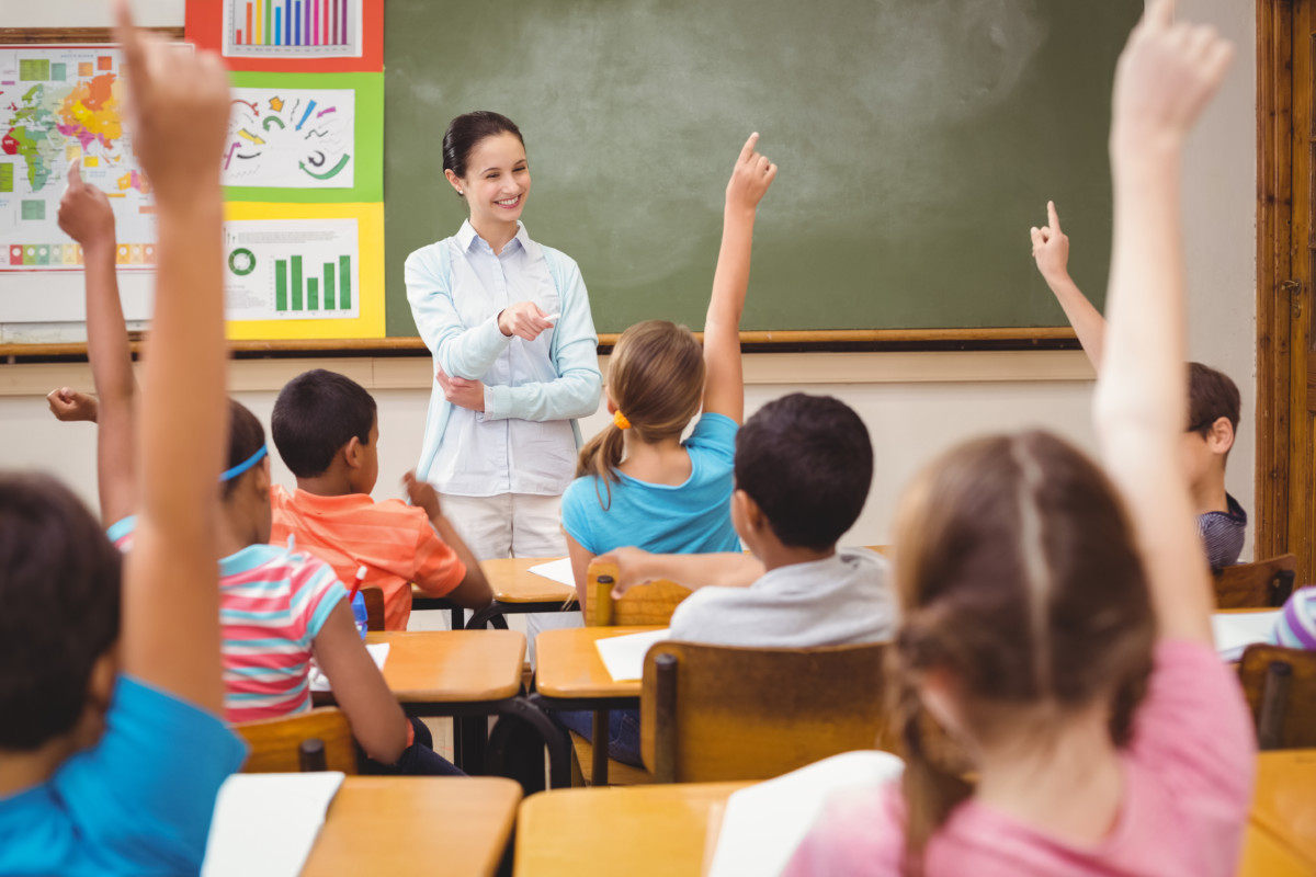 new teacher smiling in classroom